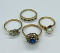 A selection of four various settings 9 ct gold rings. Total weight 8.7g