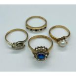 A selection of four various settings 9 ct gold rings. Total weight 8.7g