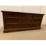 A hardwood sideboard with nine drawers 180cm L x 50cm D x 80cm H