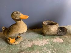 Two garden ornaments one of a duck and one of a boot (H38cm)