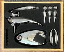 A boxed cork screw/bottle opening set