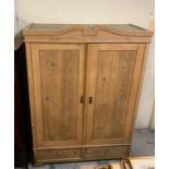 A two door pine wardrobe with two drawers under AF (no fittings) H204cm W141cm D65cm