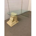 A contemporary glass coffee table with a decorative scrolled end (H49cm W120cm D65cm)
