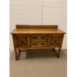 A burr oak sideboard with drawers and cupboard under with wrought iron handles (H108cm W152cm