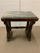 An early 19th century marble top table on wooden base (H76cm W74cm D50cm)