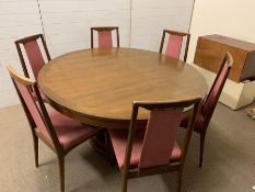 A Mid Century teak style dining table and chairs (H78cm Dia147cm)