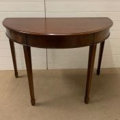 A mahogany D-End table