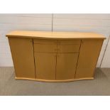 A Skovby sideboard with cupboards to sides and drawers to centre, made in Denmark (H90cm W158cm