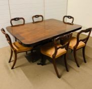 A mahogany tilt top dining table with six chairs (H74cm W162cm D117cm)