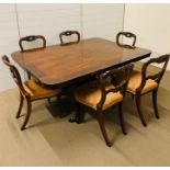 A mahogany tilt top dining table with six chairs (H74cm W162cm D117cm)