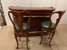 A bur elm style bar with brass rail to top and bottom along with two bar stools with swirl pads (