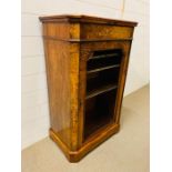 A Victorian Walnut inlaid Music Cabinet with open unglazed door opening to reveal shelving with