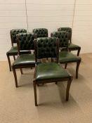 A set of six green button back leather chairs