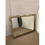 A gilt frame mantel mirror with a leaf design (H98cm W124cm)