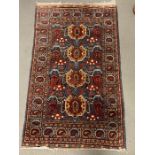 An Afghanistan rug made of silk, red grounds and boarder (182cm x 110cm)
