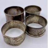 A selection of four hallmarked silver napkin rings.