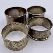 A selection of four hallmarked silver napkin rings.