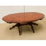 A burr elm coffee table on twin pedestal base (H52cm W140cm D70cm)
