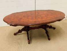 A burr elm coffee table on twin pedestal base (H52cm W140cm D70cm)