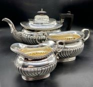 A Three piece silver tea set to include teapot, milk jug, sugar bowl (Arthur & John Zimmerman) Total