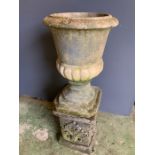 A reclaimed garden urn on a base (H78cm)