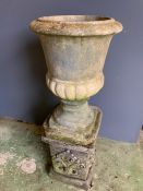 A reclaimed garden urn on a base (H78cm)