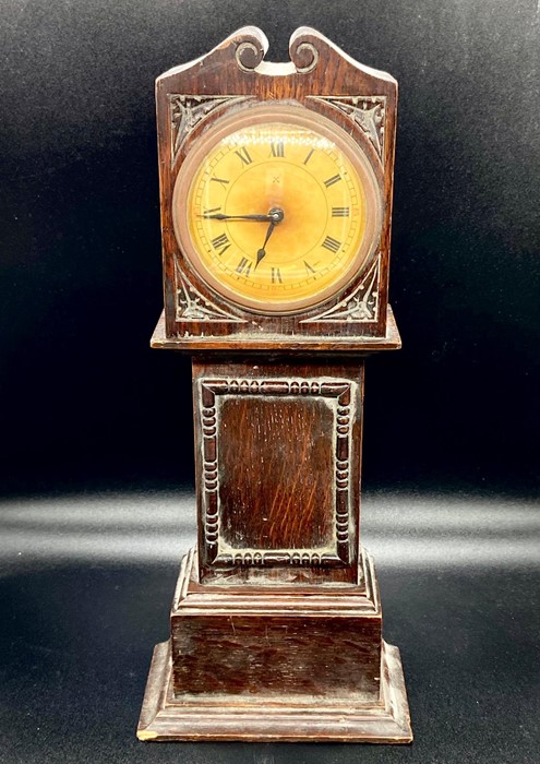 A working model of a long case clock