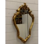 A wall hanging mirror with a gilt frame (H68cm W44cm)