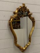 A wall hanging mirror with a gilt frame (H68cm W44cm)