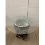 A Chinese fish bowl converted into a table