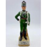 A china figure of a soldier.
