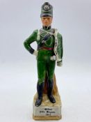 A china figure of a soldier.