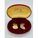 A Pair of 9ct gold Gents cuff links with ornate finish (Total Weight 7.3g)