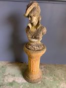A bust of a lady sat on a column