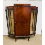 A mahogany cabinet by B E Strump of Scotland ( 115cm L x 35cm D x 126cm H )