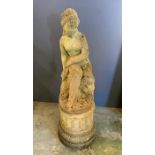 A garden statue of a lady sat down on a plith (H90cm)