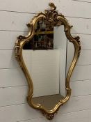 A gilt frame wall mirror