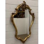 A gilt frame wall mirror