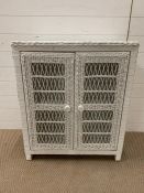 A white wicker two door cabinet (H80cm W70cm D38cm)