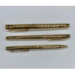 A Sheaffer gold plated pen set to include ink pen, roller ball and ball point.