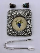 A mixed selection of silver items to include frame front, thimbles, small tongs etc.