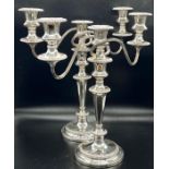 A pair of quality Barker & Ellis three light candlesticks