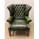 A Green Chesterfield style Wing Back chair