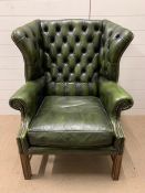 A Green Chesterfield style Wing Back chair