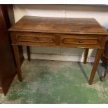 An oak two drawer writing table