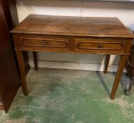 An oak two drawer writing table