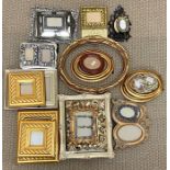 A collection of photo frames in various colours and sizes