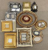 A collection of photo frames in various colours and sizes