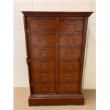 Mahogany filing drawers with double locking bars to side and brass handles, from a haberdashery or