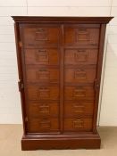 Mahogany filing drawers with double locking bars to side and brass handles, from a haberdashery or